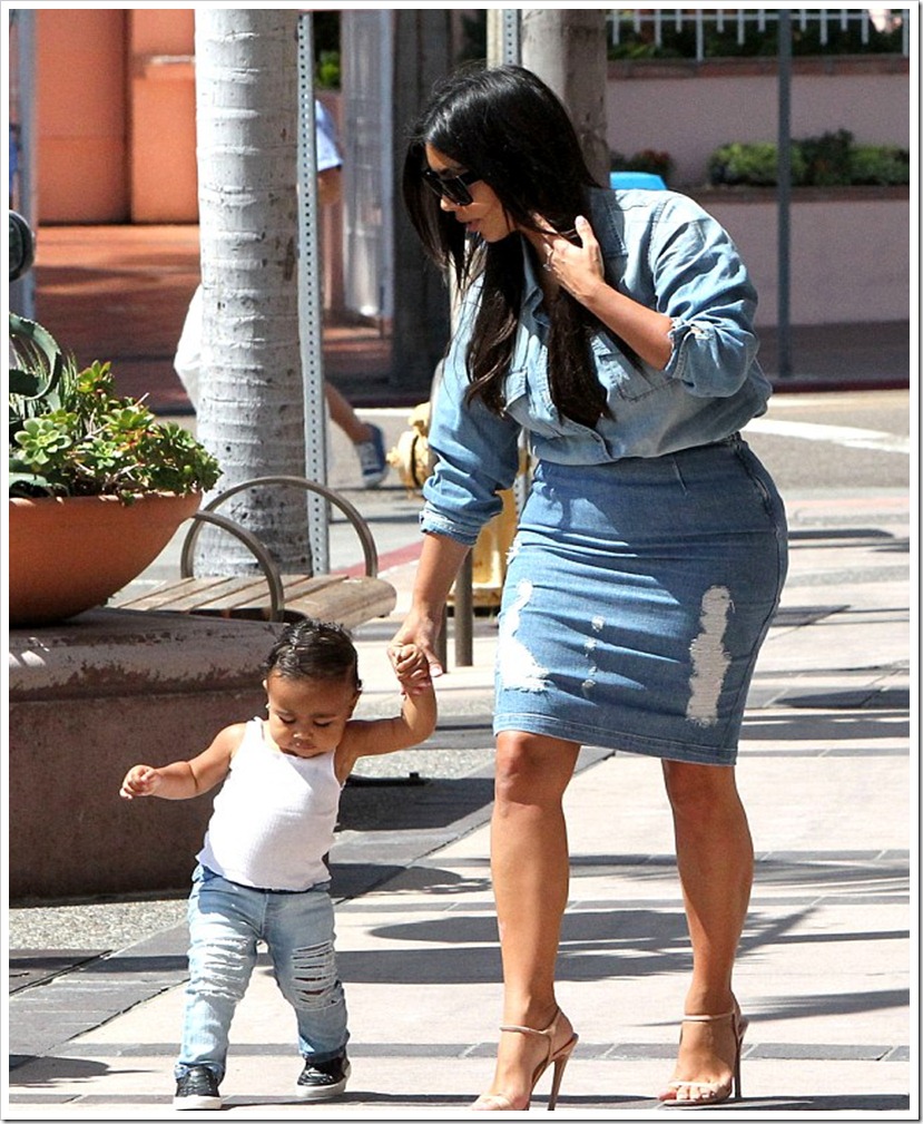 Kim Kardashian With Her One-Year-Old North In Ripped Denim